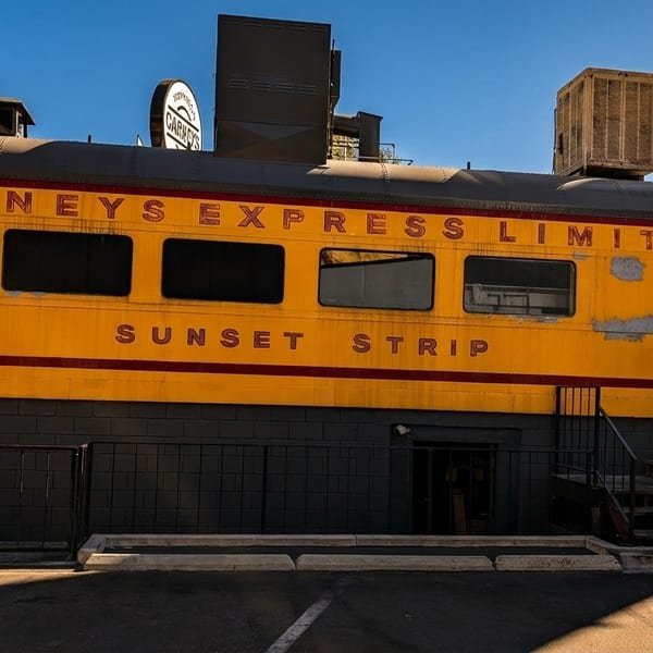 Carney's Express Limited restaurant, a bright yellow train car with "Sunset Strip" painted on its side.